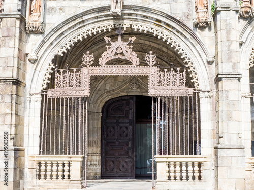 Detail of the Gothic entrance gallery and Manueline metal gate to Braga Cathedral.