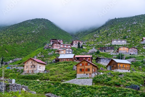Wallpaper Mural Traditional wooden houses in a scenic mountainous village, surrounded by lush greenery and misty forest in a peaceful rural setting. Turkey travel. Torontodigital.ca