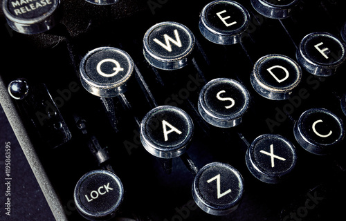 The left side of an old 1920s typewriter machine (obsolete fascinating writing technology). Above angled detail shot highlights dusty textures and mechanical details.
