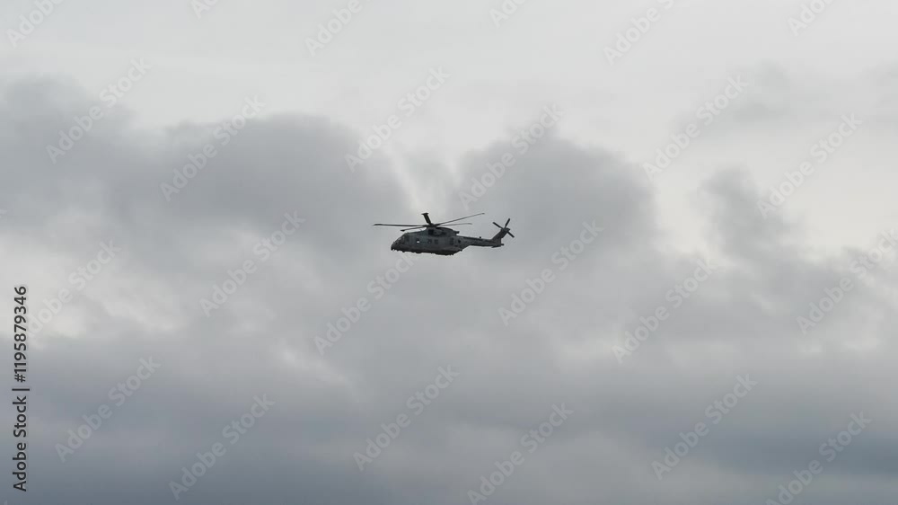 British Royal Navy Agusta-Westland Merlin HM.2 AW101 helicopter in flight on a military exercise over Wiltshire UK British Royal Navy Agusta-Westland Merlin HM.2 AW101 helicopter in flight on a military exercise over Wiltshire UK