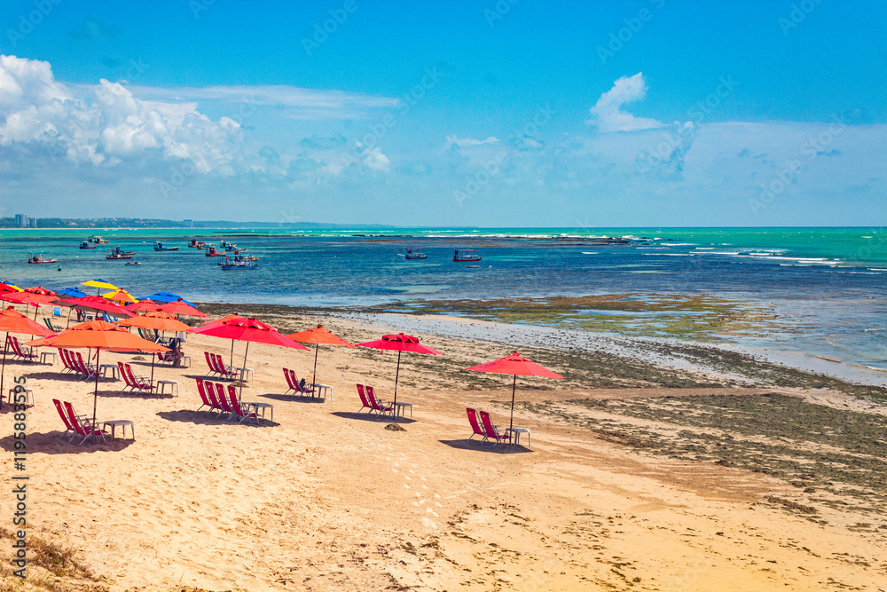 beach with umbrellas tropical beach in northeastern Brazil in the state of Alagoas, city of Maceio, Ponta Verde beach beach with umbrellas tropical beach in northeastern Brazil in the state of Alagoas, city of Maceio, Ponta Verde beach