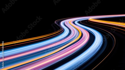 A dynamic abstract image featuring colorful light trails on a black background, evoking a sense of high speed and futuristic technology. photo