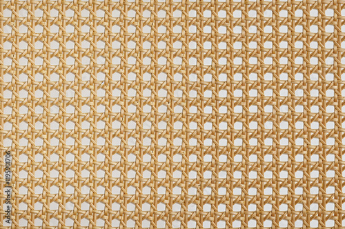 Light brown cane webbing forms a repeating grid pattern.