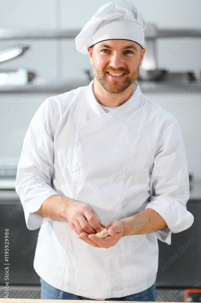 Handsome male chef making khinkali in professional kitchen. The concept of semi-finished products. Handsome male chef making khinkali in professional kitchen. The concept of semi-finished products.