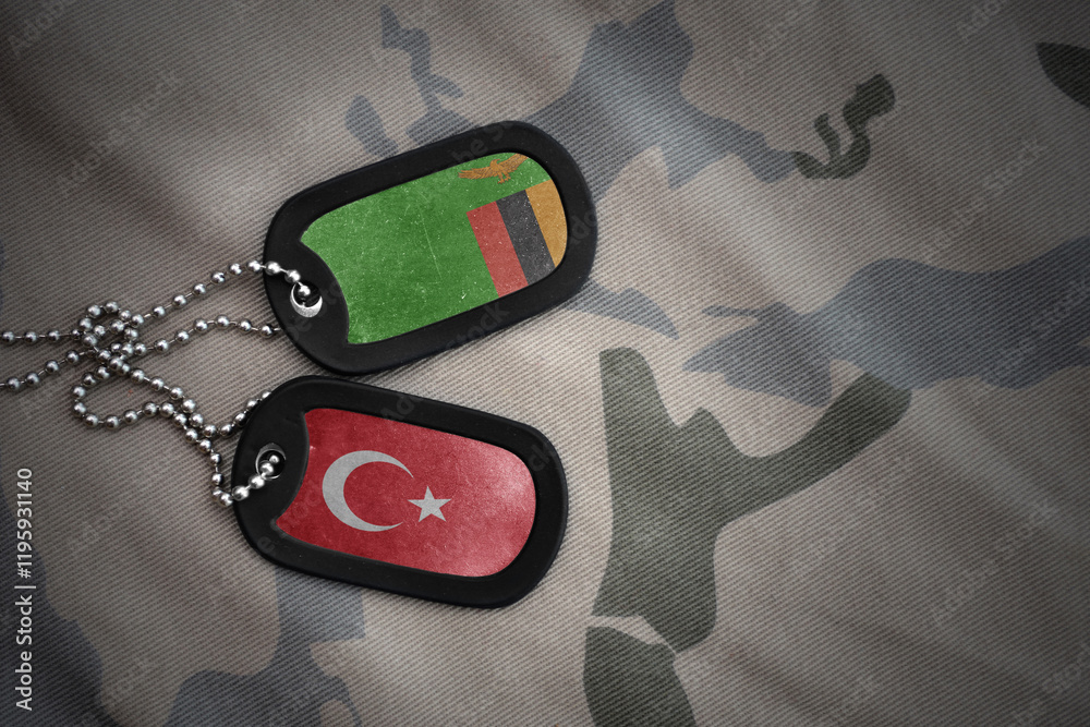 Φωτογραφία vintage army blank, dog tag with flag of zambia and turkey on the khaki texture background