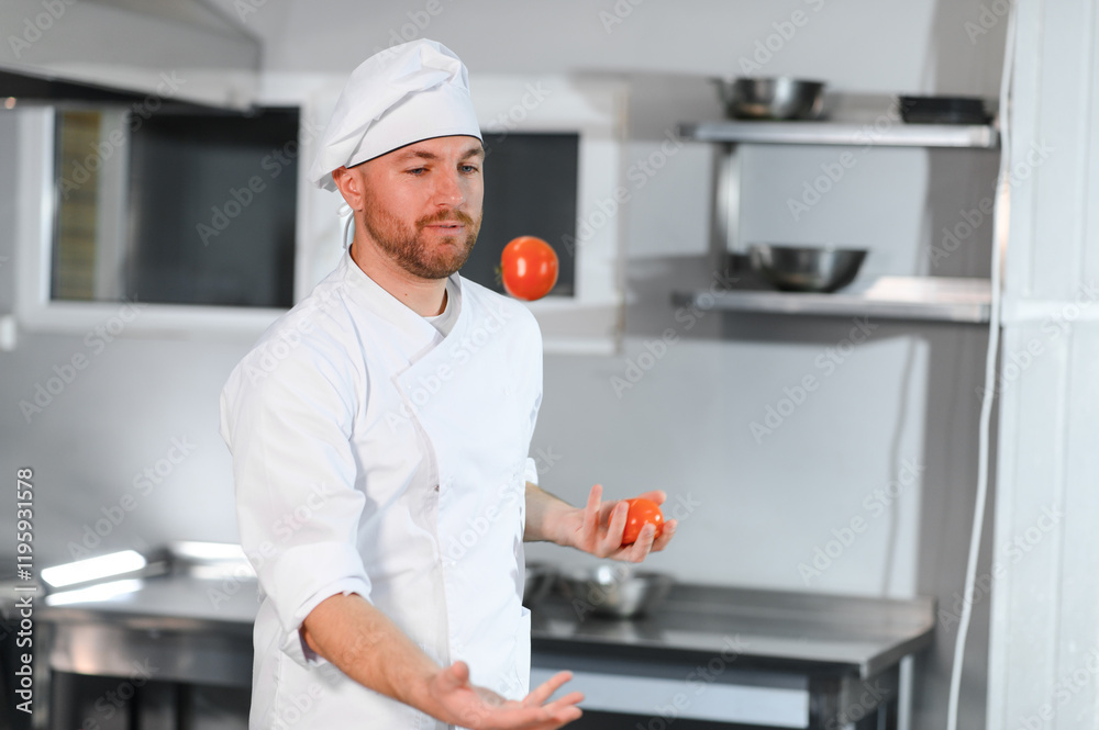 Cheerful and funny male chef juggling vegetables in restaurant kitchen Cheerful and funny male chef juggling vegetables in restaurant kitchen