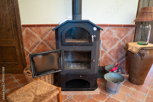 Traditional wood burning stove in a cozy interior setting photo