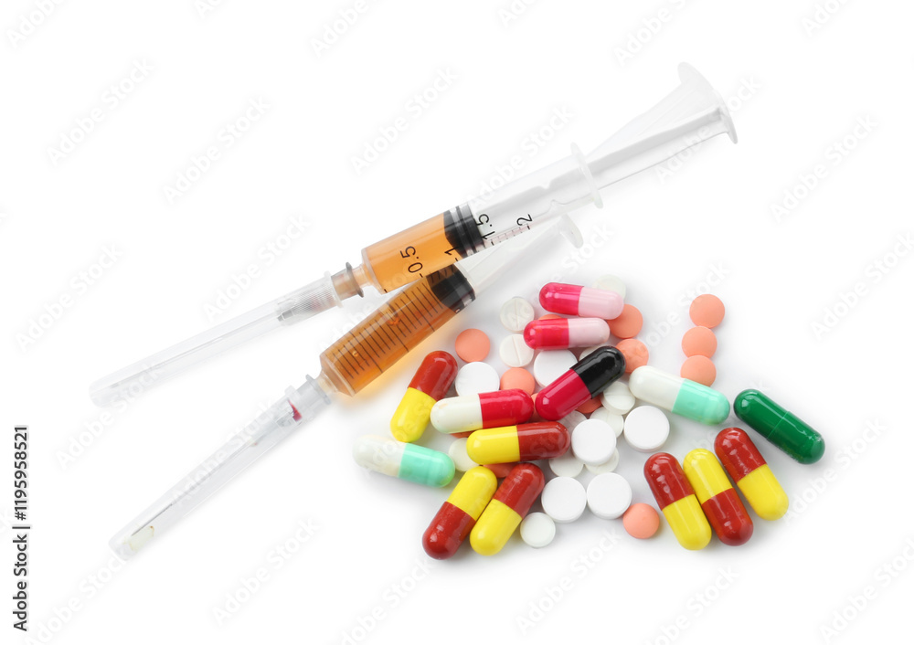 Drug addiction. Different pills and syringes isolated on white, top view Drug addiction. Different pills and syringes isolated on white, top view