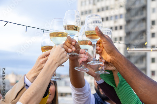 Group of Friends Toasting at a Festive Rooftop Celebration photo