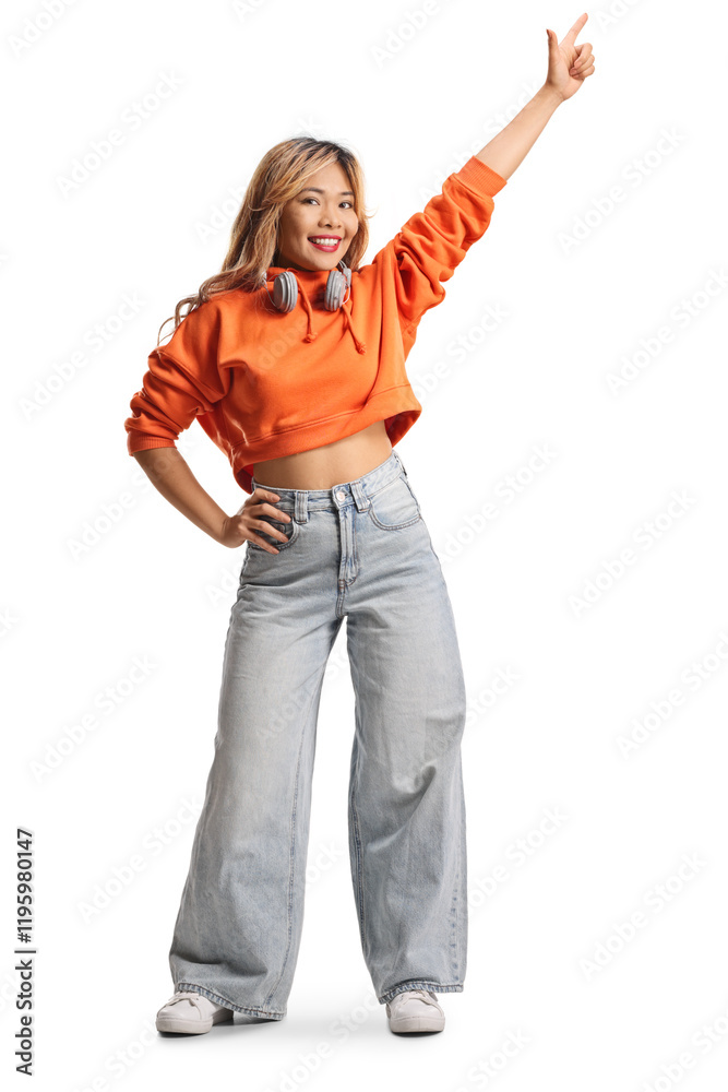 Young asian female with headphones dancing Young asian female with headphones dancing