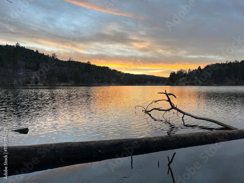 sunset shadows over the lake with clouds