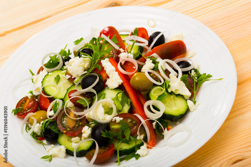 Traditional dish of Balkan cuisine salad with fresh vegetables, brynza cheese and onion Traditional dish of Balkan cuisine salad with fresh vegetables, brynza cheese and onion