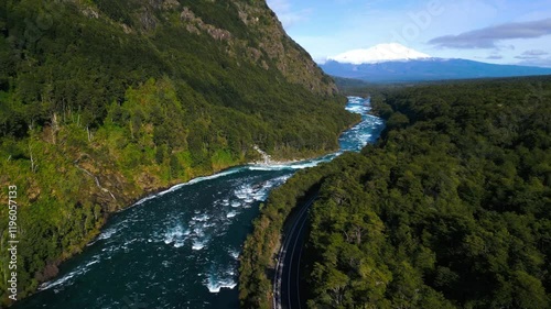Aerial View of a Scenic River with Rapids Flowing through a Forested Canyon
