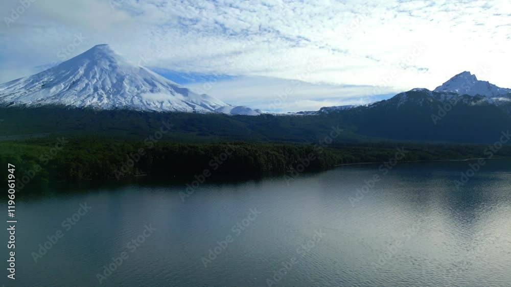 Aerial View of Snow-Capped Volcano and Lake Surrounded by Forest Aerial View of Snow-Capped Volcano and Lake Surrounded by Forest