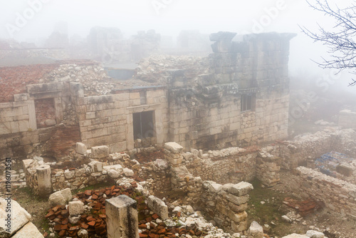 View of ruins of Roman Baths complex in ancient Pisidian town of Sagalassos on foggy winter day, Turkey photo