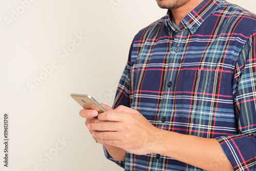 Person hand typing on mobile phone photo