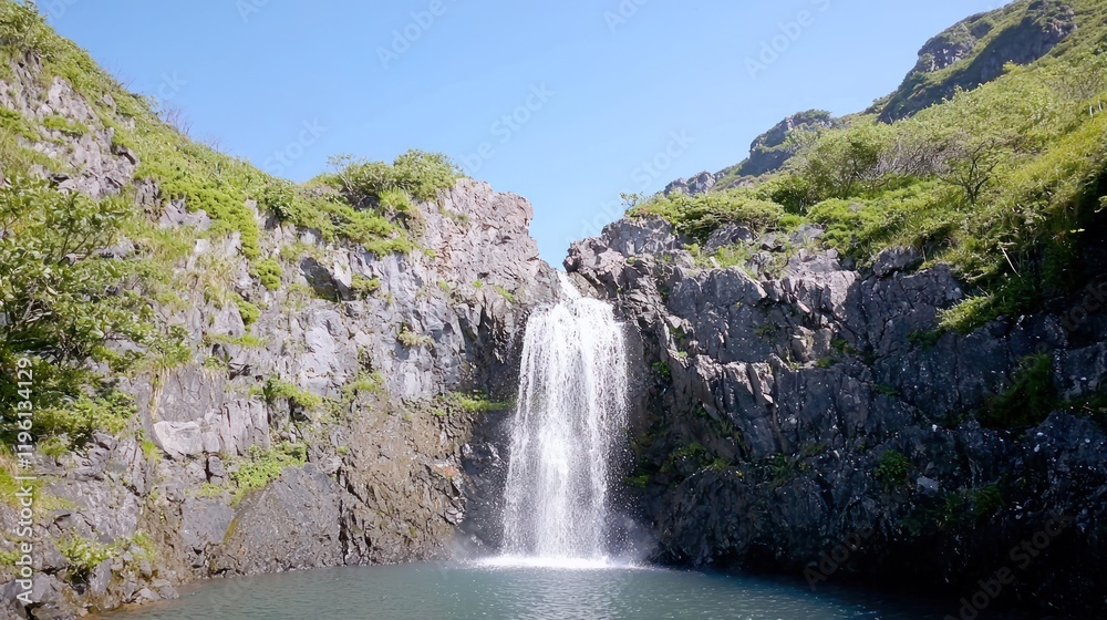 Obraz premium Refreshing Waterfall in Mountain Landscape