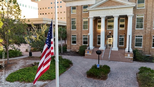 Manatee County Clerk of Circuit Court with U.S. flag flying at half mast, Bradenton, Florida photo