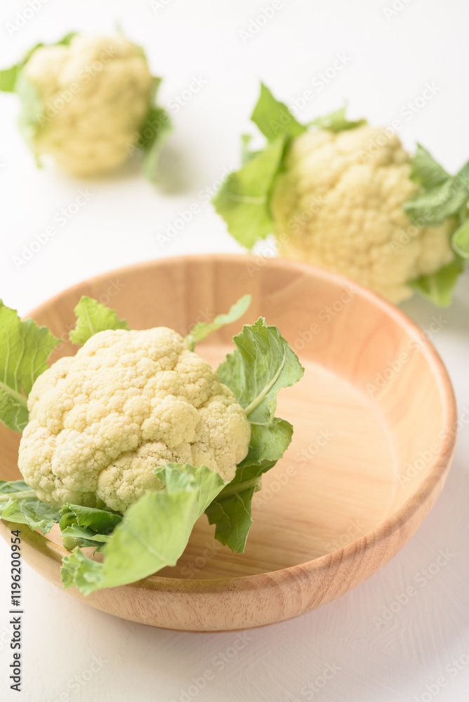 Fresh cauliflower on white background. Local organic farm produce for healthy food ingredients. Fresh cauliflower on white background. Local organic farm produce for healthy food ingredients.