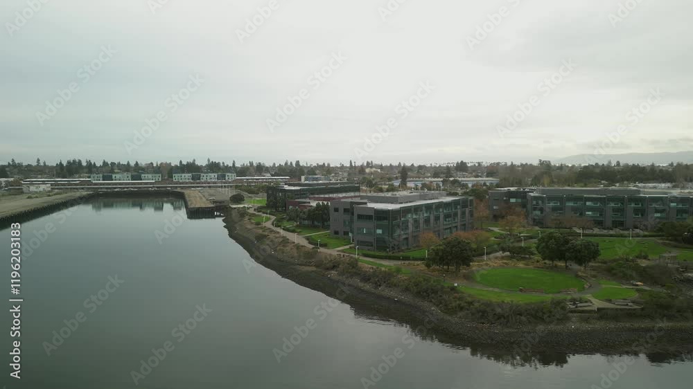 Elevated perspective of Mariner Square, capturing the vibrant marina life and the calm waters of Alameda's coastal haven. Elevated perspective of Mariner Square, capturing the vibrant marina life and the calm waters of Alameda's coastal haven.