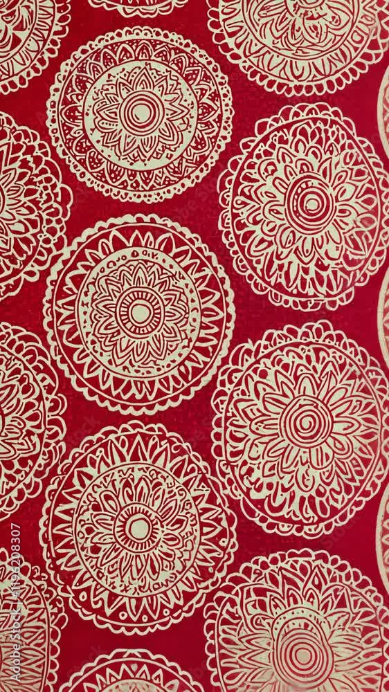 Intricate red mandala patterns create a vibrant backdrop for artistic designs and crafts
