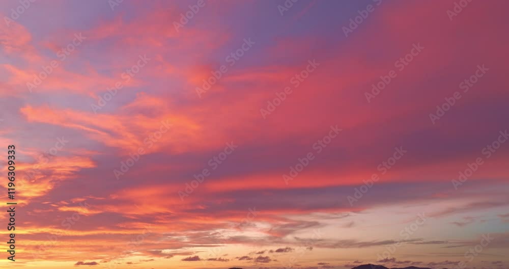 An aerial view of the Phuket islands bathed in soft pastel hues during sunset. The tranquil sea below is dotted with islands, while the sky above is painted with delicate pink and orange clouds. An aerial view of the Phuket islands bathed in soft pastel hues during sunset. The tranquil sea below is dotted with islands, while the sky above is painted with delicate pink and orange clouds.