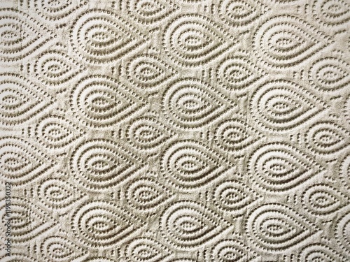 Luxurious textured pattern with embossed water drop art design on beige paper.
