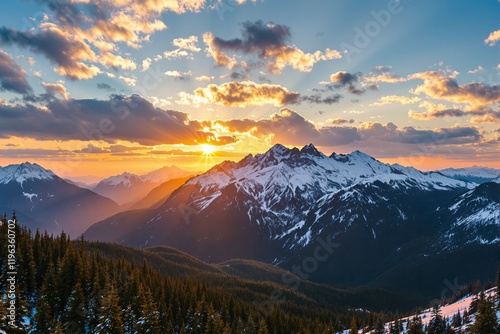 Stunning sunrise over snowy mountain peaks with vibrant sky and clouds. photo