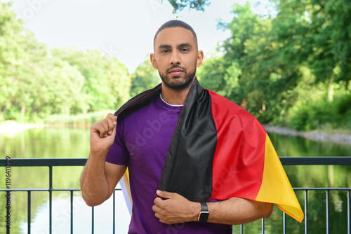Young man with flag of Germ...