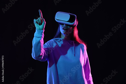 Young woman using VR glasse...