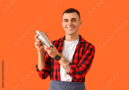 Young male bartender with s...