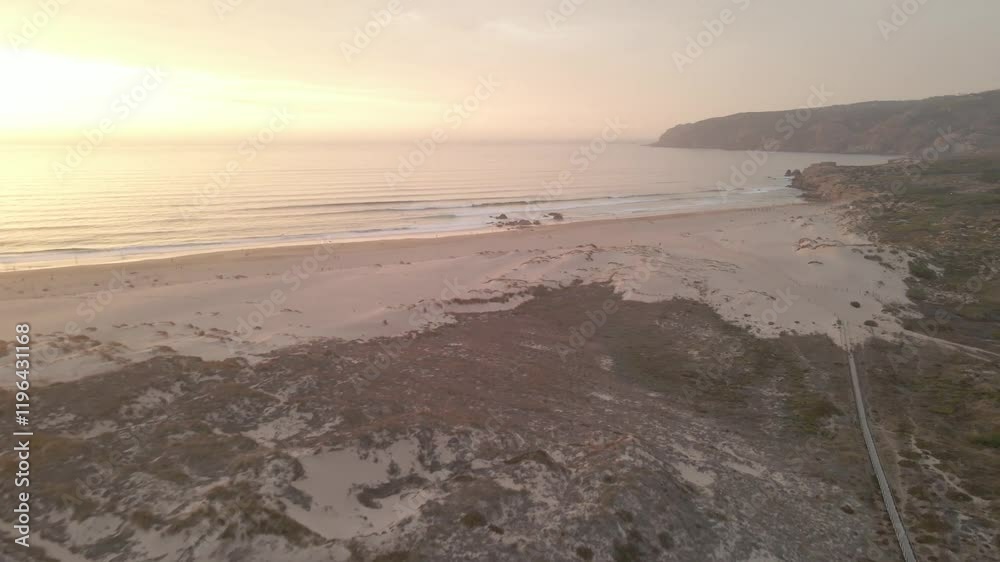 view of the beach with the sunrise from above using a drone view of the beach with the sunrise from above using a drone