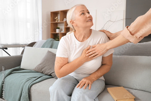 Mature woman having heart a...
