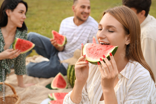 Young woman eating watermel...