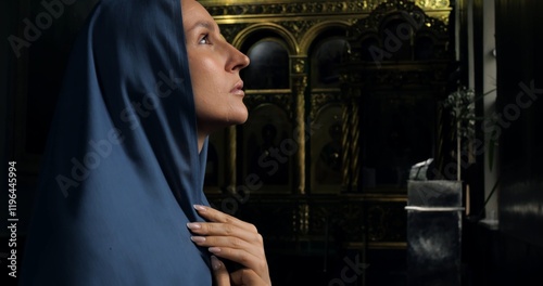 Peaceful image of woman in deep contemplation in Catholic setting, representing strength of religious conviction, surrounded by sacred symbols. Catholic faith concept Cinematic shot of woman and faith