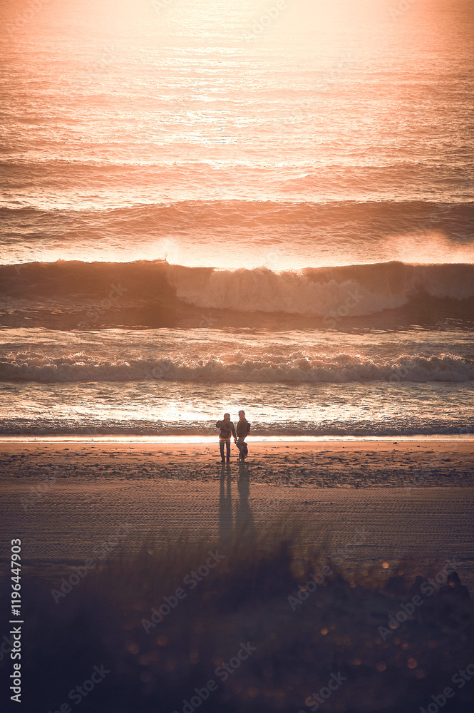 Couple at coast in sunset light. High quality photo Couple at coast in sunset light. High quality photo