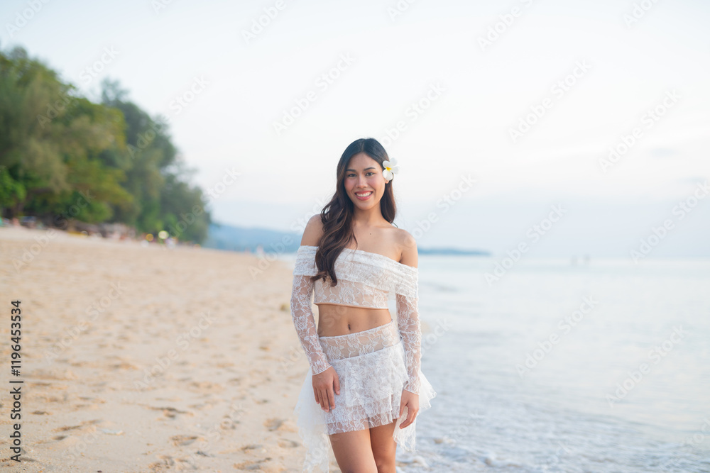 Beautiful Young Thai Woman at Tropical Beach During Sunset Beautiful Young Thai Woman at Tropical Beach During Sunset