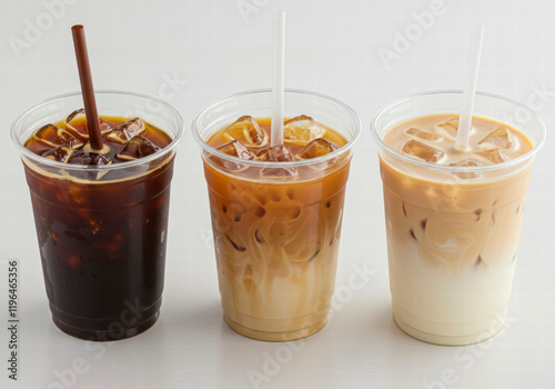 Wallpaper Mural Three iced coffee beverages in clear cups with straws, showcasing different levels of milk and cream Torontodigital.ca