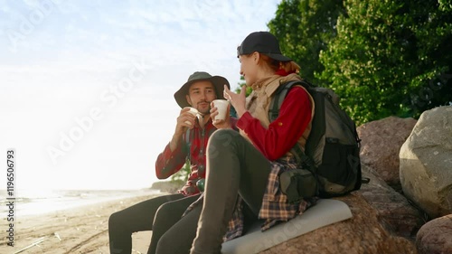 Leisure in weekend, people hiking in beautiful places, man and woman in halt. Summertime and autumn vacation, active young people traveling in national park, resting on lakeshore and drinking hot tea