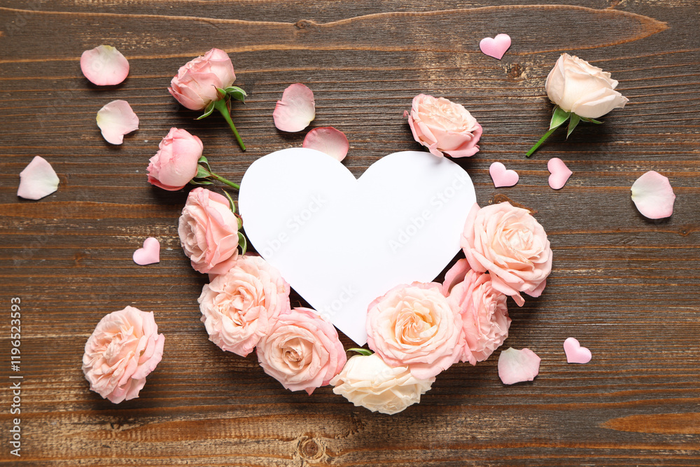 Composition with rose flowers and blank paper heart on wooden background. Valentine's Day celebration Composition with rose flowers and blank paper heart on wooden background. Valentine's Day celebration