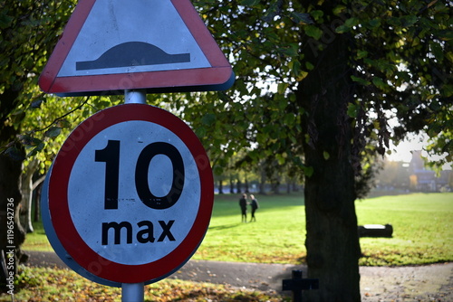 Canvas Print View a generic road hump and 10 mph max speed limit road signs on a country lane