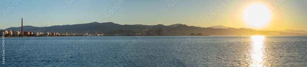 Sunrise over the beach and city in Malaga, Spain Sunrise over the beach and city in Malaga, Spain