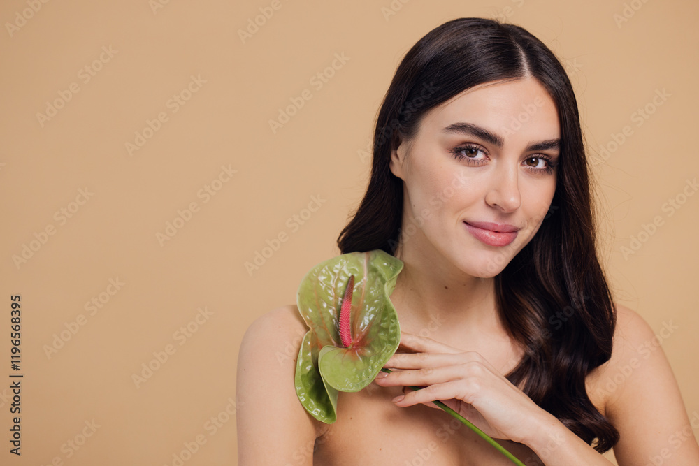 Beauty portrait of attractive young naked woman posing with flower Beauty portrait of attractive young naked woman posing with flower