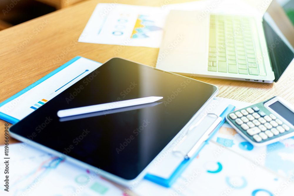 Work space at home, Businessman or an accountant are analyzing data charts, graphs, and discuss financial data in an office, Financial analysis or business evaluation concept Work space at home, Businessman or an accountant are analyzing data charts, graphs, and discuss financial data in an office, Financial analysis or business evaluation concept