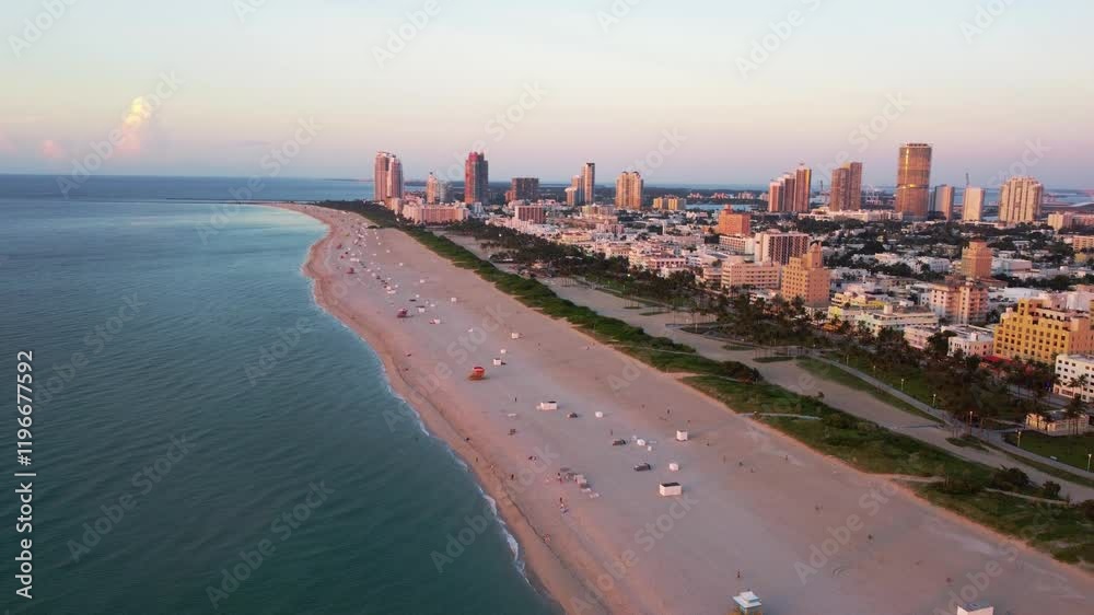 4K Miami Beach at sunset, blue ocean, bright sky and cityscape in the background