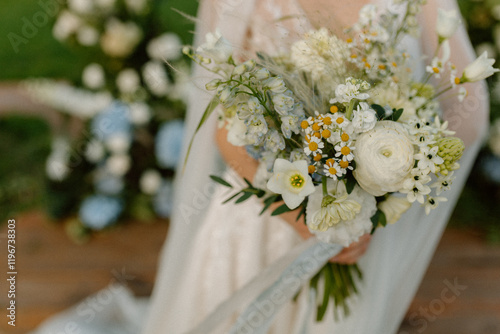 Modern stylish wedding bouquet of wild flowers. The wedding decor. The pastel colors flowers bouquet. Natural beautiful wedding decorations. Minimalistic wedding decorations