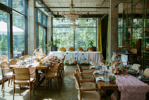 Modern stylish wedding table setting. Fairytale wedding decoration. Vibrant colors, vintage style. The pastel colors flowers bouquet. Natural beautiful wedding table setting  