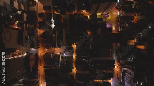 City skyline illuminated at night showcasing vibrant lights and bustling streets