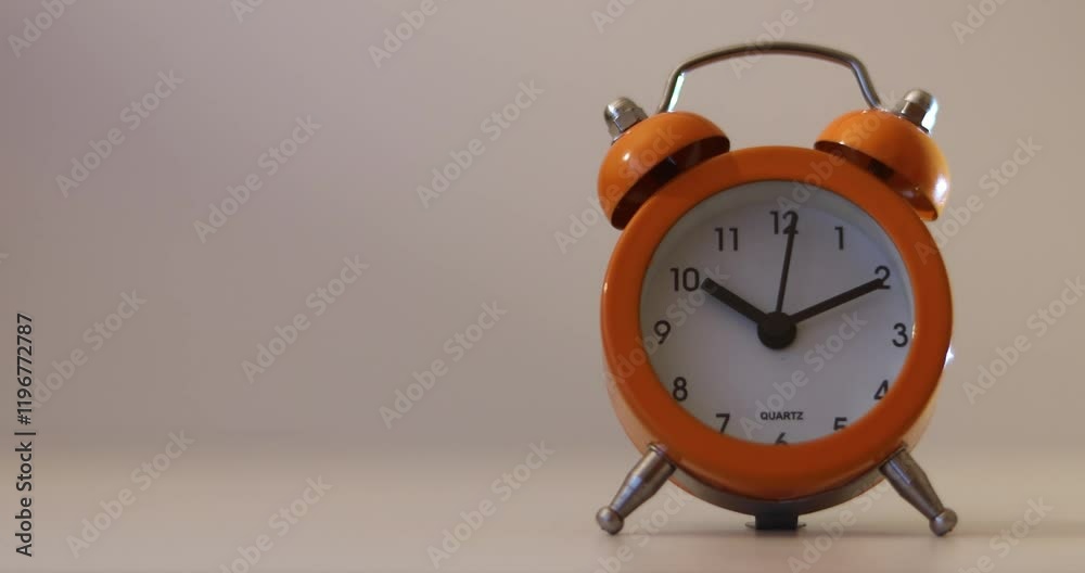 Orange The clock sets the time to 10.00. on white background 4k
