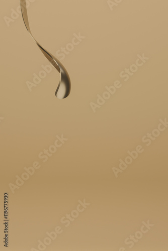 Swirling abstract shapes create dynamic movement in a smooth golden background